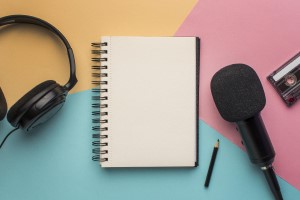 copy space notepad with mic headphones